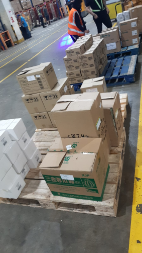 Carton boxes stacked on a wooden pallet for transportation