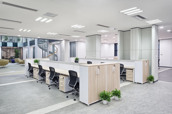 An office setup featuring a spacious, elongated desk and chairs